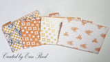 Orange Patchwork on White Paper